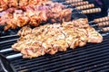 Marinated shashlik preparing on a barbecue grill over charcoal. Shashlik or Shish kebab popular in Eastern Europe. Shashlyk skewe Royalty Free Stock Photo