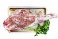 Marinated whole mutton leg, raw lamb meat with thyme, spices and olive oil. Isolated, white background. Royalty Free Stock Photo