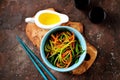 Marinated wild garlic ramson with carrots, white balsamic vinegar, olive oil and seasonings. Top view. Royalty Free Stock Photo