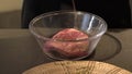 Marinating Beef Steak with spices and oil in bowl and refrigerate overnight.