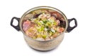 Marinating meat with spices and onion in the pot on whi Royalty Free Stock Photo