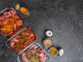 Marinating raw meat in different spices, herbs and marinades, with soy sauce and oil, with copy space Royalty Free Stock Photo