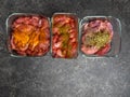 Marinating raw meat in different spices, herbs and marinades, with soy sauce and oil, with copy space Royalty Free Stock Photo