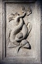 Marine animal, fish in bas-relief