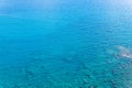 Marine background, transparent blue coastal littoral over coral reef