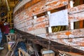 Marine carpenters restores a boat on Robert Leglise shipyard in Port Le Chateau d`Oleron, France