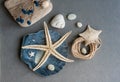 Marine composition with shells, starfish and pebbles.