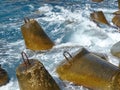 Marine concrete breakwaters anchors in shallow water. Traveling-wave protection, concrete breakwater Royalty Free Stock Photo