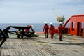 marine crew working on deck during anchor handling operation