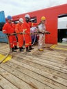 Marine crews conduct fire drill on board ship