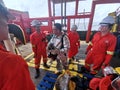 Marine crews conduct fire drill on board ship