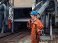 Marine Deck Officer or Chief mate on deck of ship with VHF radio Royalty Free Stock Photo