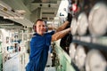 Marine engineer officer controlling vessel enginesand propulsion in engine control room ECR Royalty Free Stock Photo