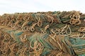 Marine fishing nets stacked together Royalty Free Stock Photo