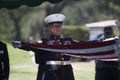 Marine folding flag at Memorial Service for fallen US Soldier, PFC Zach Suarez, Honor Mission on Highway 23, drive to Memorial