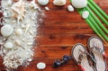 Marine items on wooden background. Sea objects - seashells, corals on wooden planks. Beach still life. Royalty Free Stock Photo