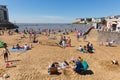 Marine lake beach Weston-super-Mare Somerset in August summer sunshine with tourists and visitors Royalty Free Stock Photo