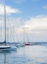 Marine landscape with a lot of luxury boats and yachts at sunset moored at pier. Summer holidays under the sails yacht as your Royalty Free Stock Photo