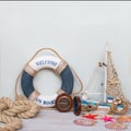 Marine life with starfish, boat, compass and seashells. Copy space on light background, retro toned Royalty Free Stock Photo