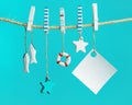 Marine or nautical themed background, summer sea toys lifeline, starfish and small fish hanging Royalty Free Stock Photo