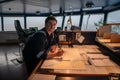 Marine navigational officer during navigational watch on Bridge Royalty Free Stock Photo