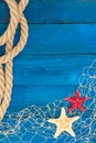 Marine network rope and starfish on a blue disk