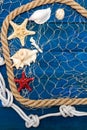 Marine network rope and starfish on a blue disk