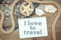 Marine objects and text in Notepad: I love to travel Royalty Free Stock Photo