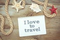 Marine objects and text in Notepad: I love to travel Royalty Free Stock Photo