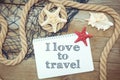 Marine objects and text in Notepad: I love to travel Royalty Free Stock Photo