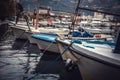 Marine port with moored yachts and boats in sea during sunset Royalty Free Stock Photo
