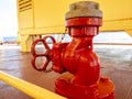 Marine red valve hydrant, part of fire extinguishing system. Industrial fire safety concept