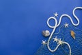 Top view of fishing net, seashell, starfish, rope on the dark blue background.Empty space for design Royalty Free Stock Photo