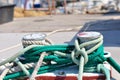 Marine rope on mooring bollard in port Royalty Free Stock Photo