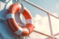 Marine safety lifebuoy and rope on handrails of frigate