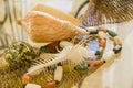 Marine shells and natural stones beads over straw basket