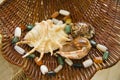 Marine shells and natural stones beads in straw basket