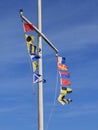 Marine signal flags hanging from a yardarm