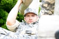 Marine, soldier in his army fatigues perform physical training on on obsticle course