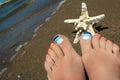 Marine striped multicolored pedicure. Royalty Free Stock Photo