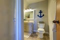 Marine style bathroom interior in soft tones