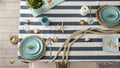 Marine style table setting with rope, shells and starfishes Royalty Free Stock Photo