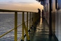 Marine supervisors observing project at corridor of a construction work barge