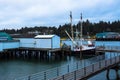 Marine vessels on the ocean inlet harbor in twilight