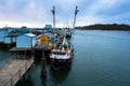 Marine vessels on the ocean inlet harbor in twilight