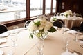 Marine wedding decor - floral arrangements with white roses and fish shaped table numbers