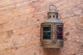 A mariners lamp on an old wood floor Royalty Free Stock Photo