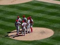 Mariners Pitcher steps forward to throw pitch to Cardinals batter