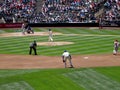 Mariners Pitcher steps forward to throw pitch to Cardinals batter