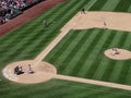 Mariners Pitcher steps forward to throw pitch to Cardinals batter Kolten Wong